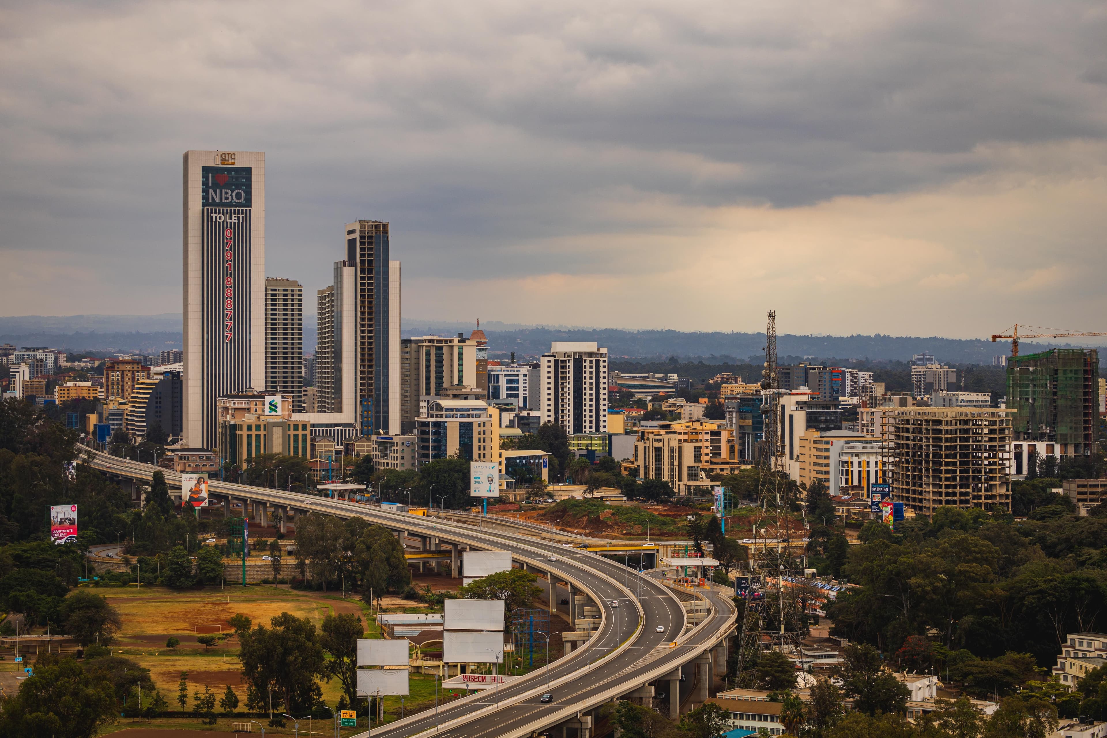 Nairobi's skyline and expressway under an overcast sky.