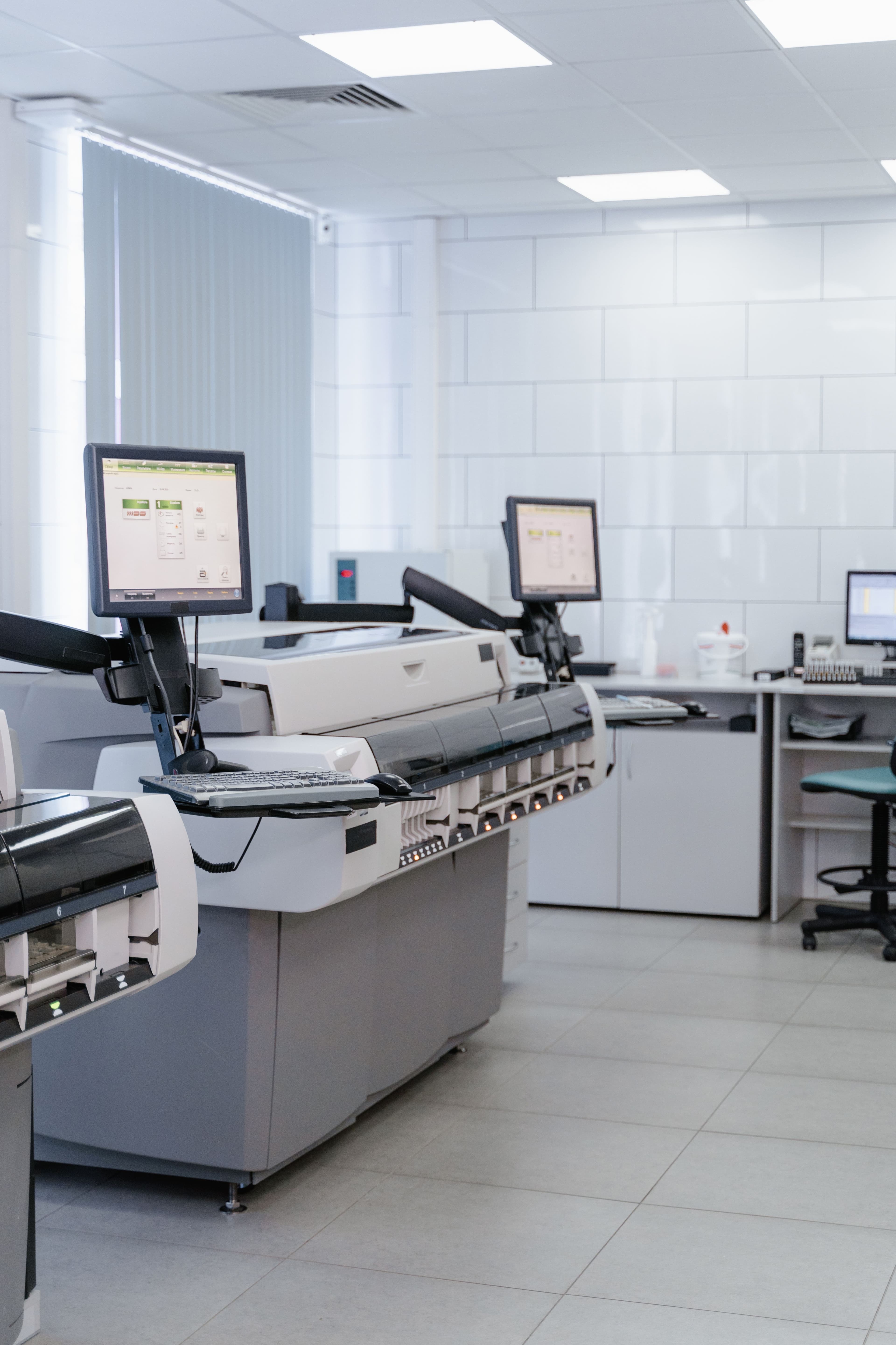 An empty, well-equipped clinical laboratory workspace.